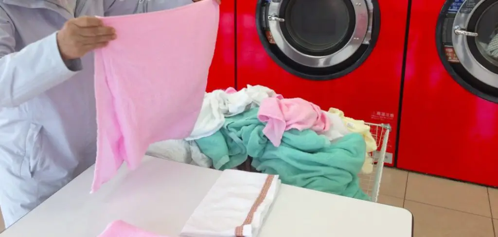 A person is standing in the laundry & packing towels