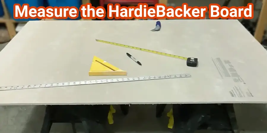 Measuring tools are placed on top of the HardieBacker (Cement) board
