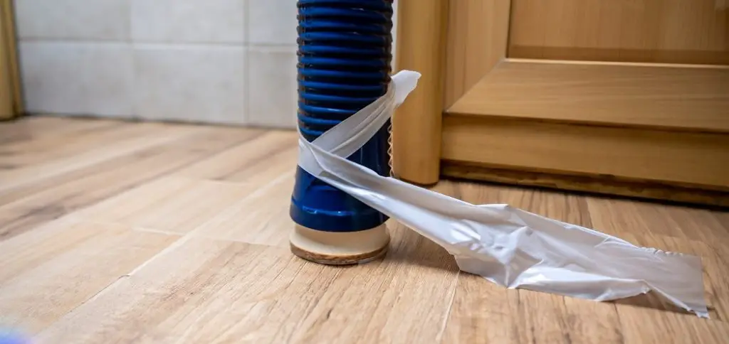 tape warp on flexible toilet waste pipe for stop leak